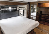 2014 GRAND DESIGN MOMENTUM 385TH interior primary bedroom