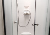 Palomino Puma 25RKQB Travel Trailer interior 3 piece bathroom