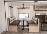 Palomino Puma 25RKQB Travel Trailer interior dining banquet