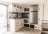 Palomino Puma 25RKQB Travel Trailer interior rear kitchen