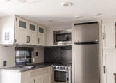 Palomino Puma 25RKQB Travel Trailer interior rear kitchen