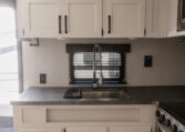 Palomino Puma 25RKQB Travel Trailer interior rear kitchen