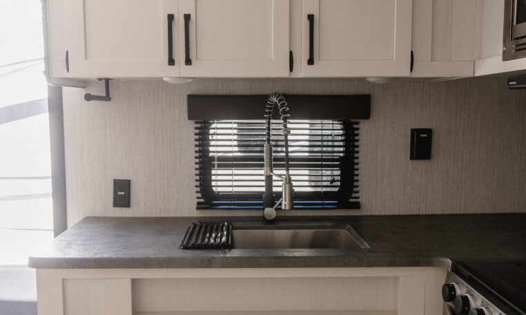 Palomino Puma 25RKQB Travel Trailer interior rear kitchen