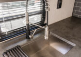 Palomino Puma 25RKQB Travel Trailer interior rear kitchen