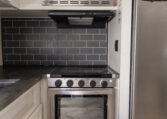 Palomino Puma 25RKQB Travel Trailer interior rear kitchen
