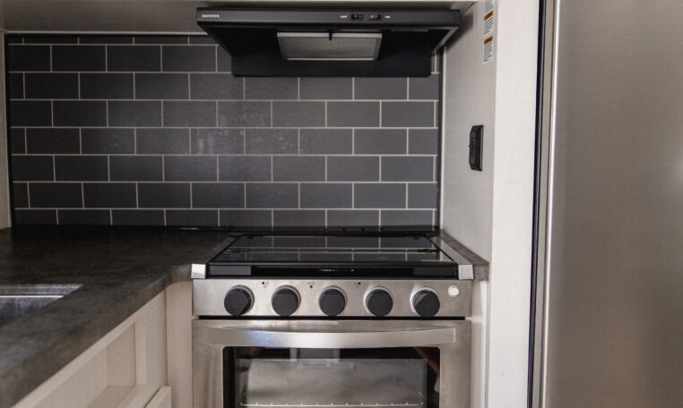 Palomino Puma 25RKQB Travel Trailer interior rear kitchen